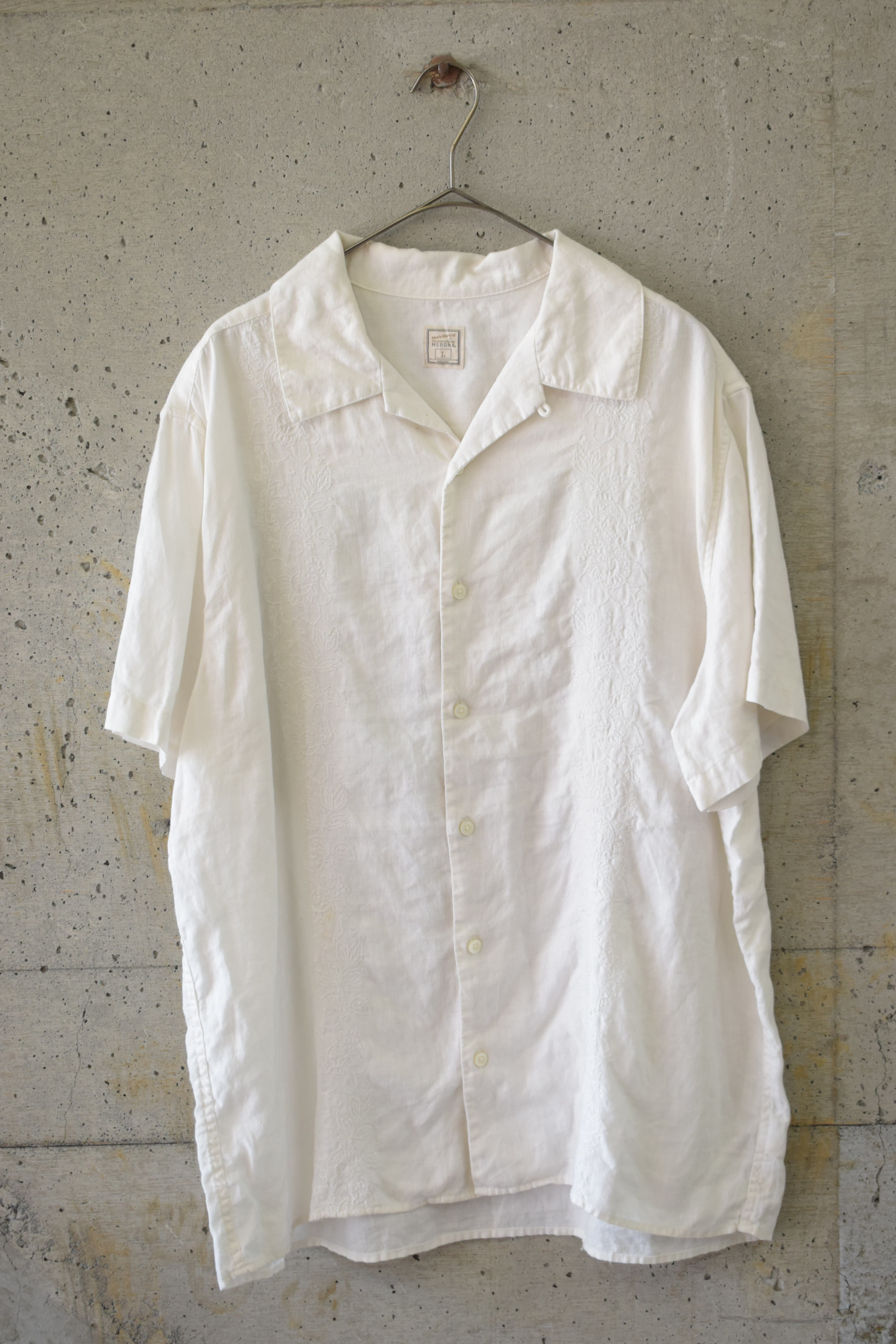 White embroidered open-collar shirt