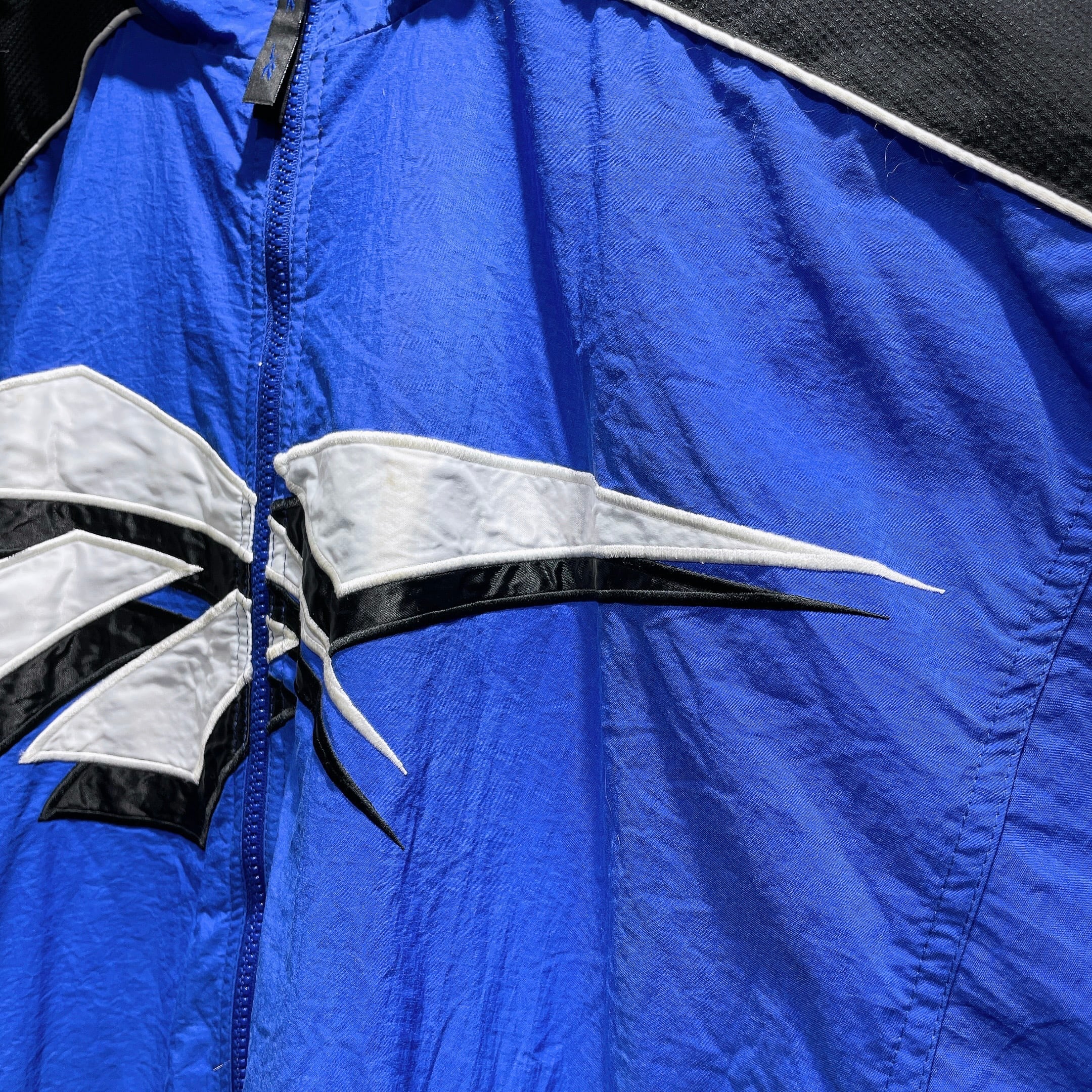 1990s ” Old Reebok ” Big vector logo Embbossed vintage Track jacket