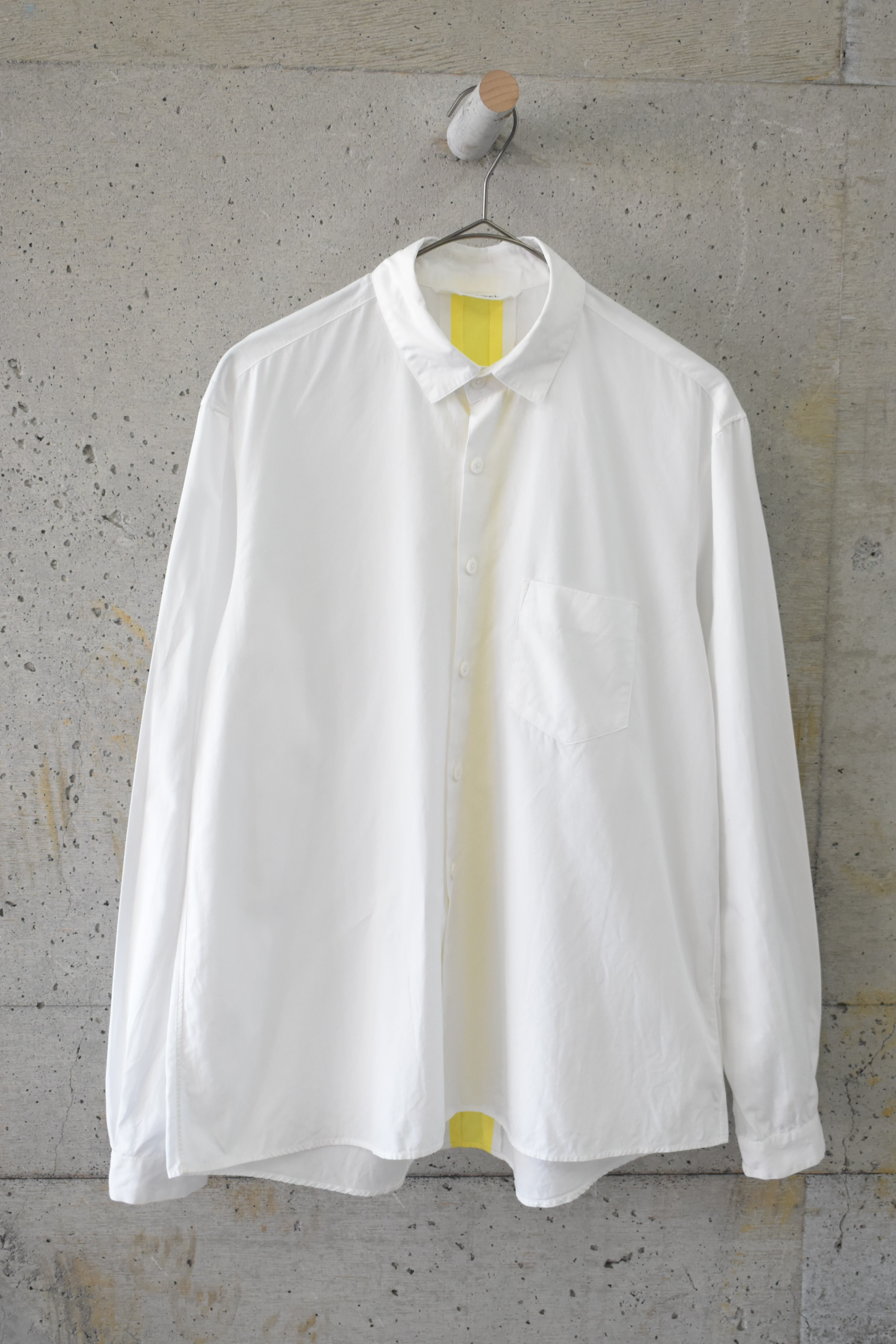White shirt with yellow stripe at the back