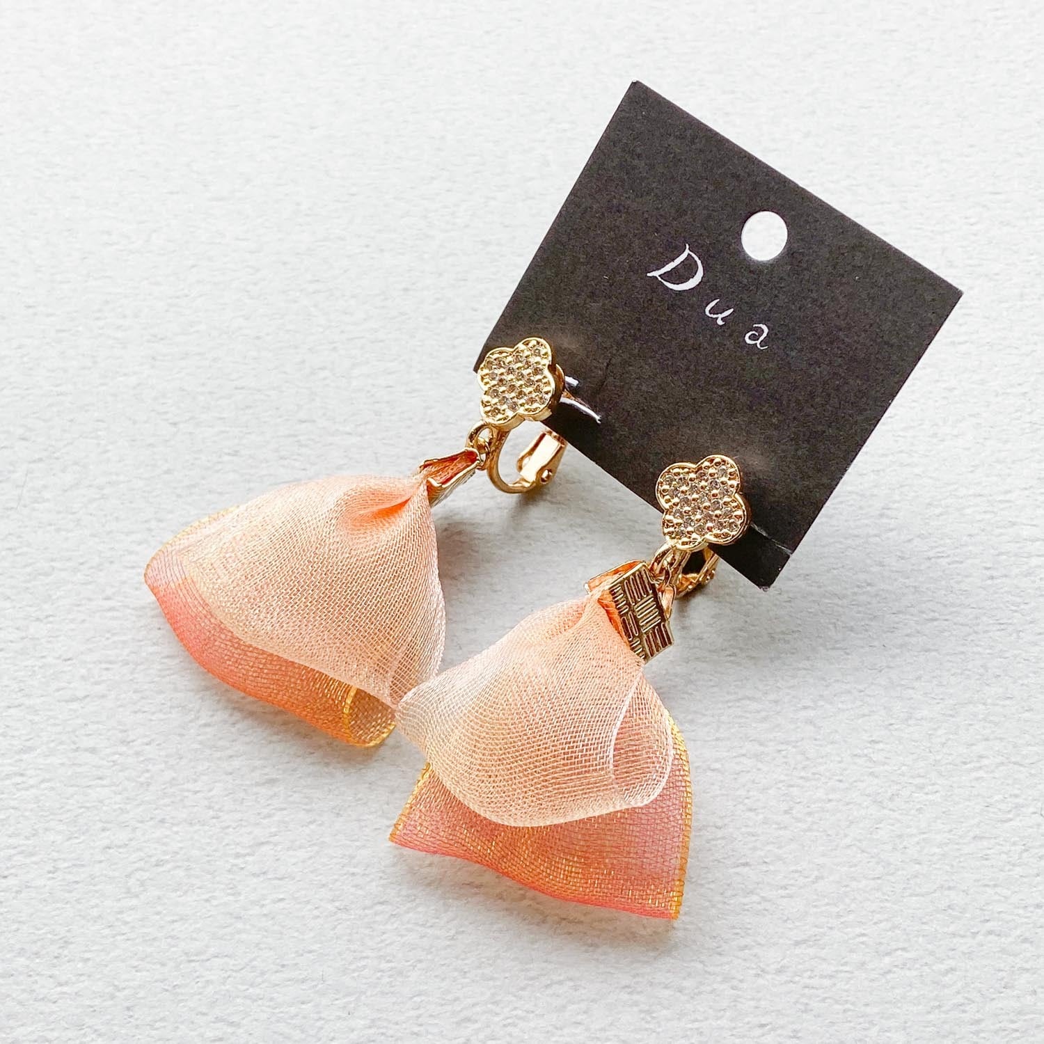 ジルコニアとオレンジオーガンジータッセルの〈ピアス/イヤリング