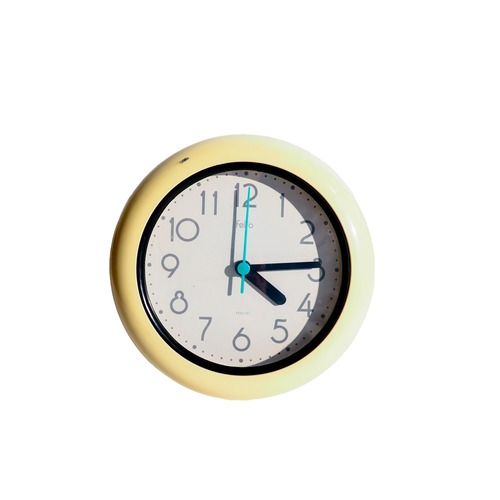 Cream-colored wall and table clock