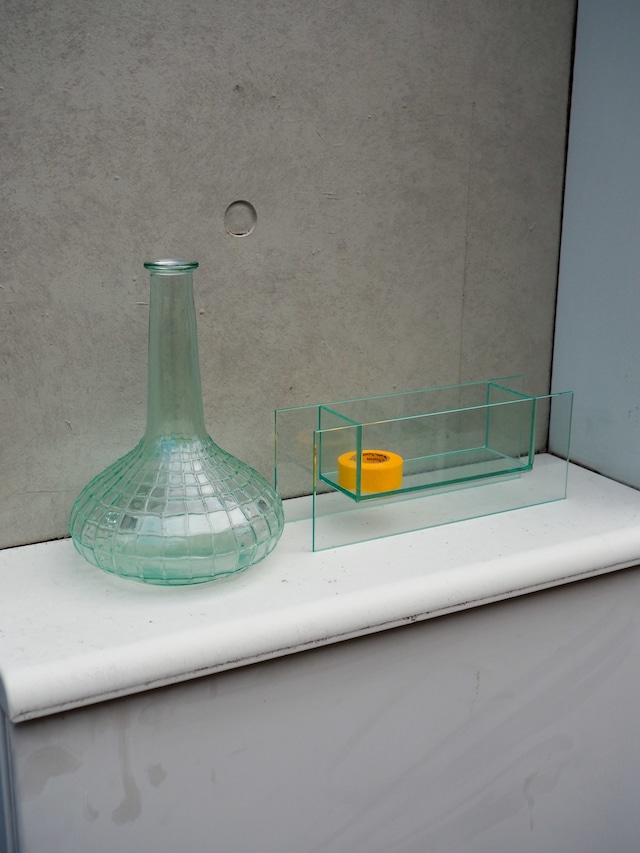 A glass vase resembling a spiderweb