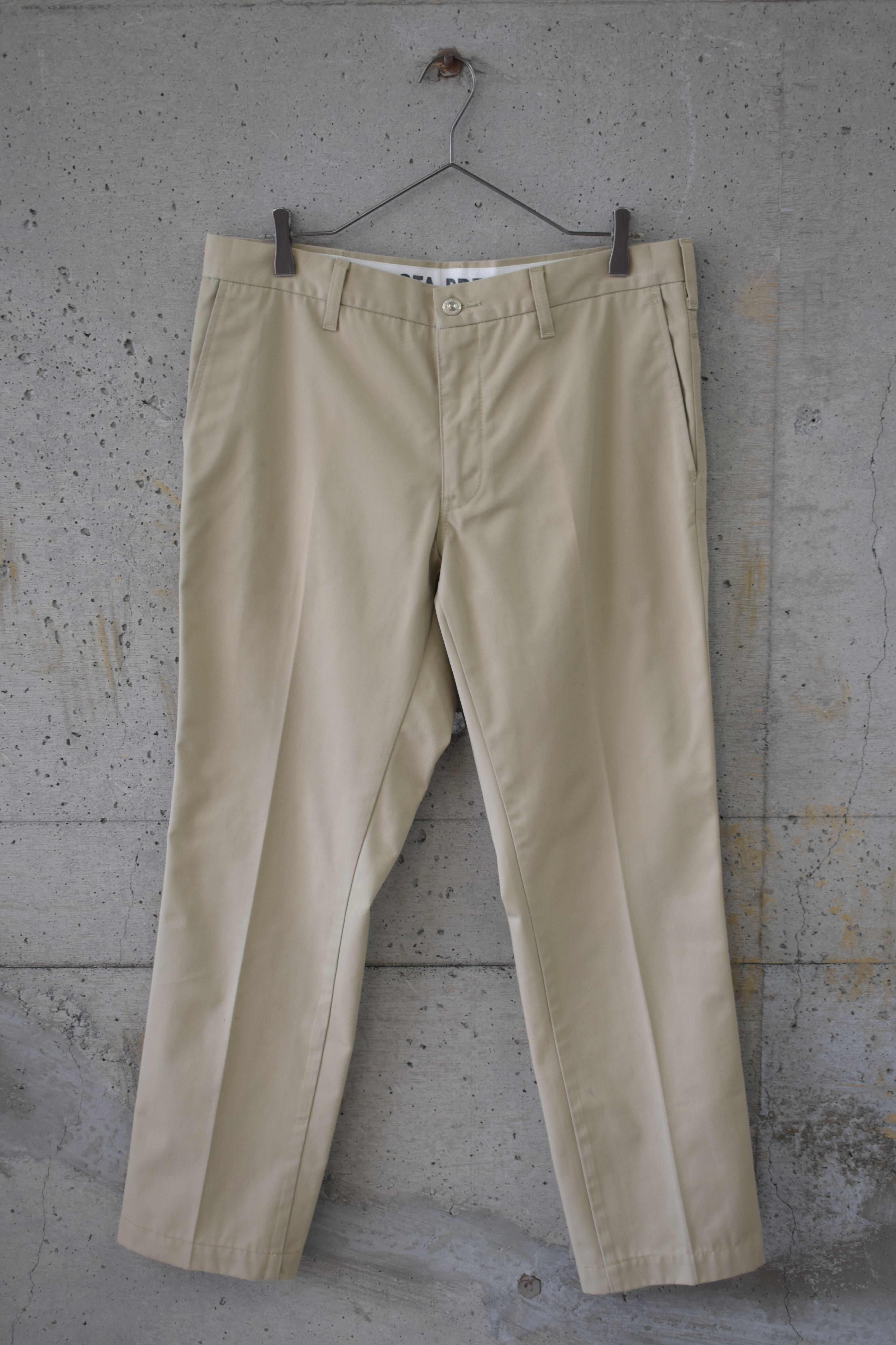 Beige pleated chinos