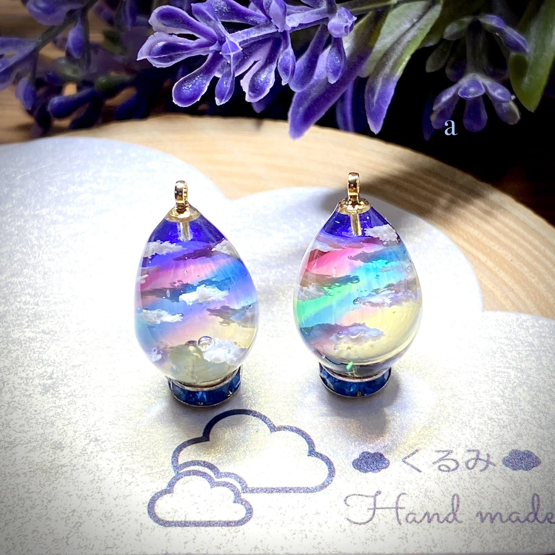 レジンピアス イヤリング 夕暮れ空にかかる虹 たまご型16×12mm a | PAY ID