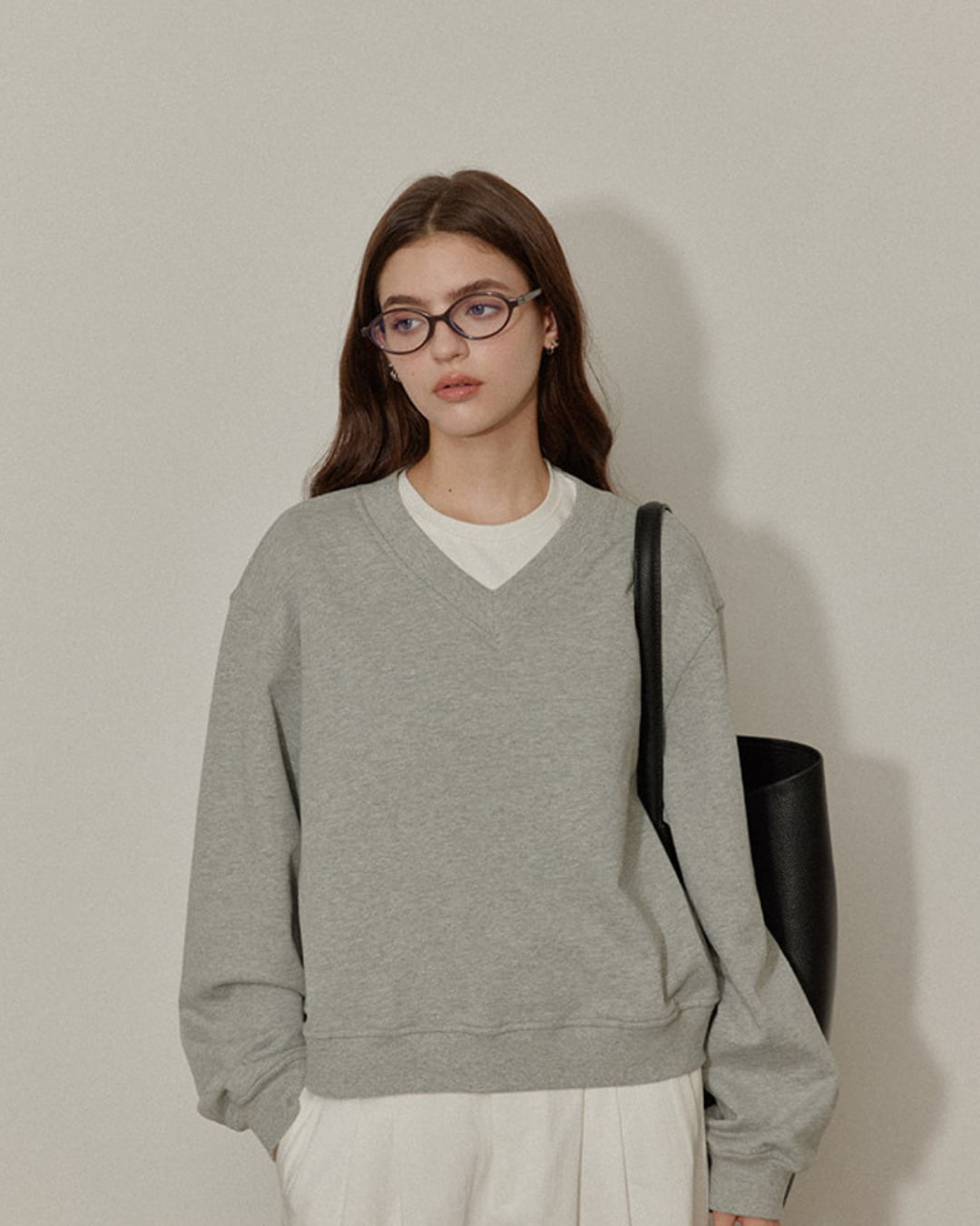 gray V-neck sweatshirt