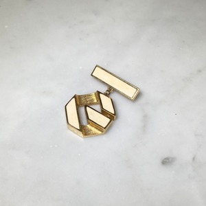 vintage GIVENCHY metal gold color "g " logo brooch with white enamel