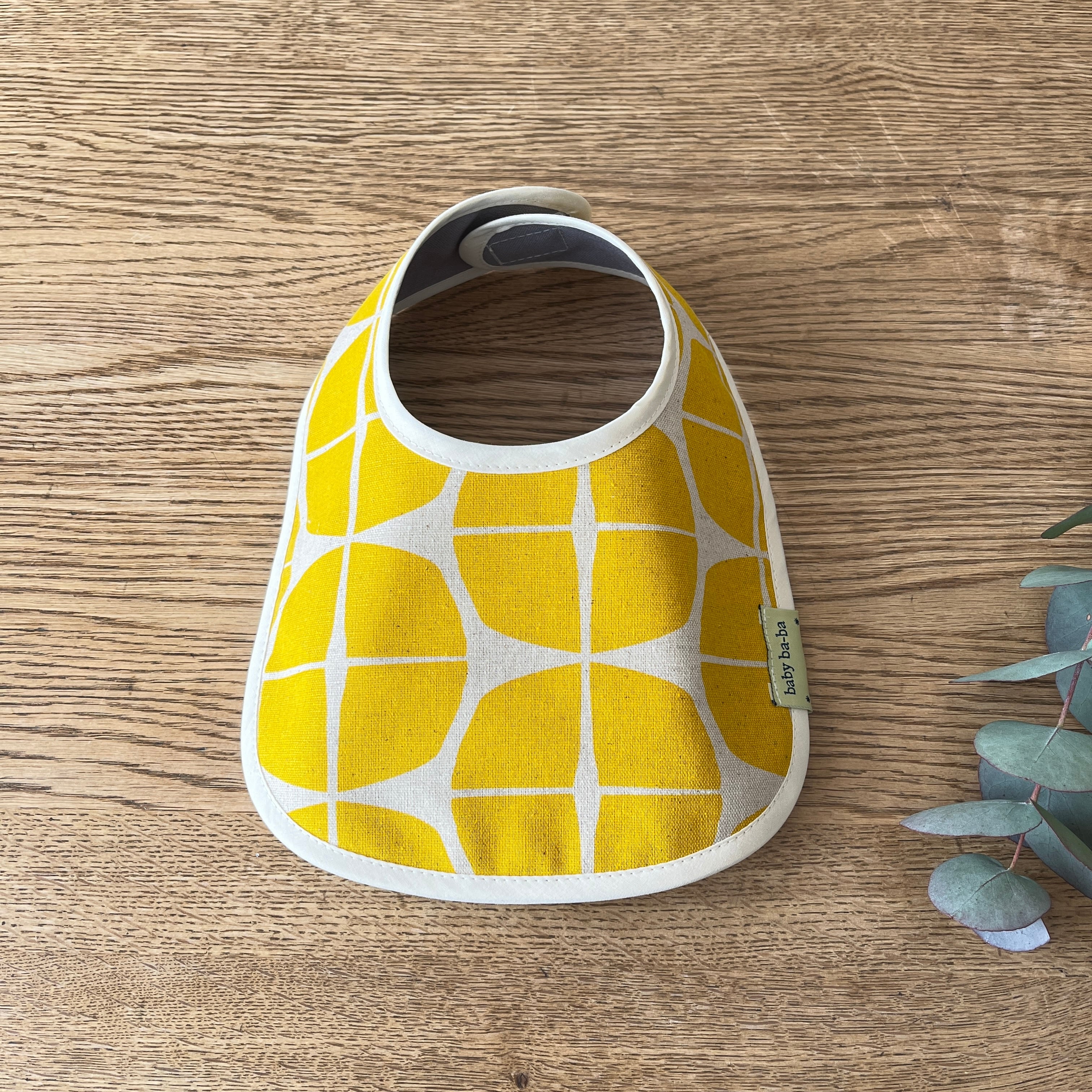 リバーシブルベビースタイ・黄色サークル柄 | baby ba-ba（ベビーバーバ）