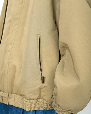HED MAYNER "HIGH NECK ZIP UP BLOUSON 〔KHAKI〕"
