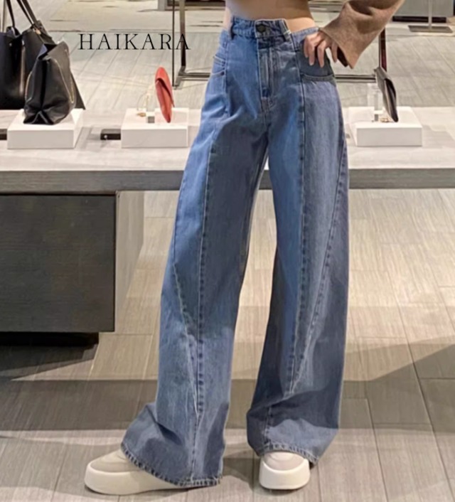 High-waisted jeans with switching processing and deformed design