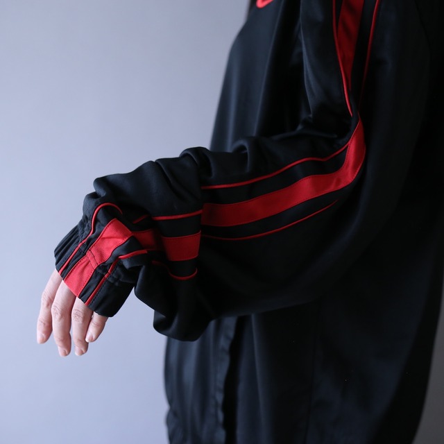 "NIKE" black × red over silhouette track jacket
