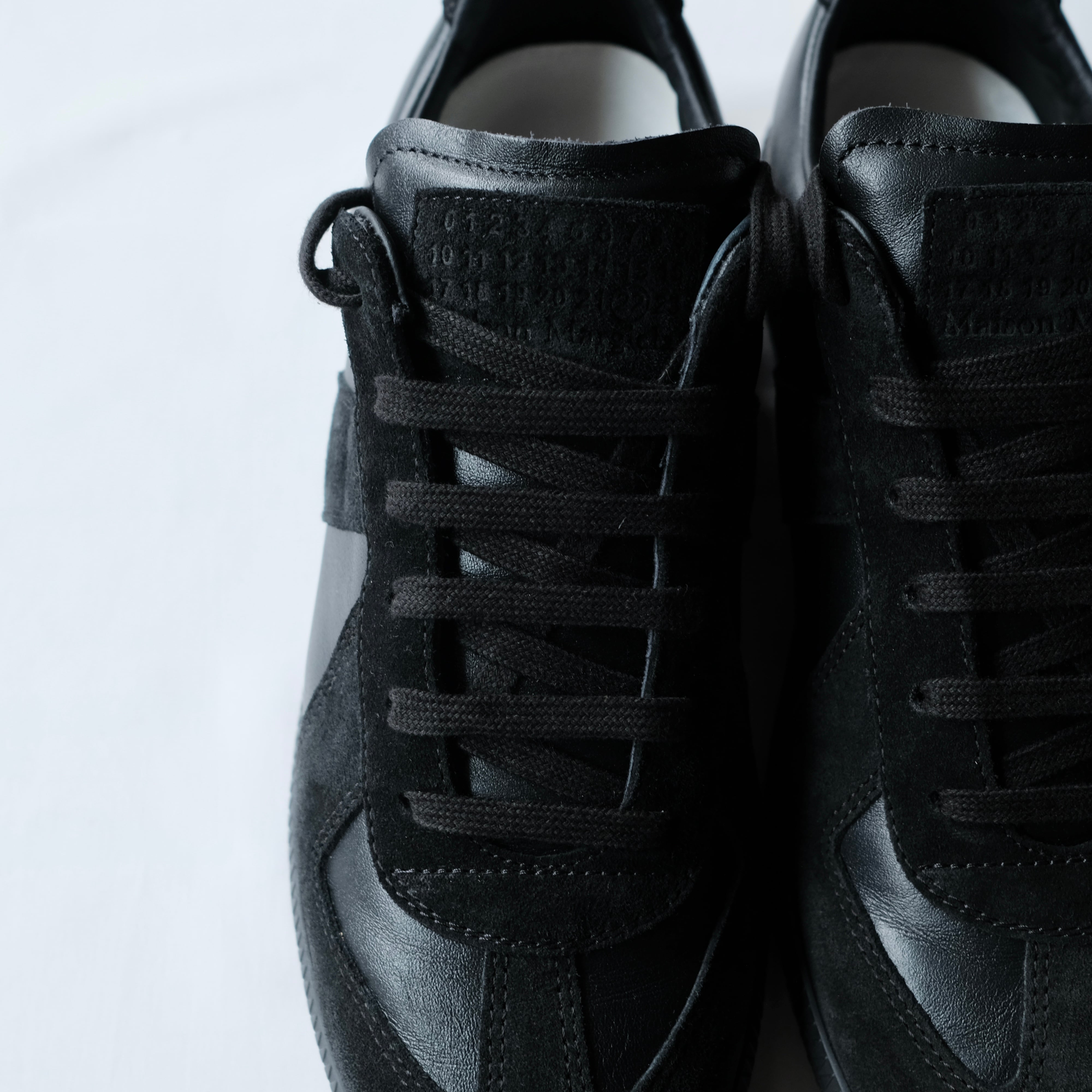 【名品図鑑】Maison Margiela ブラック ジャーマントレーナー 42 Maison Margiela GERMAN TRAINER 42 | safarionline