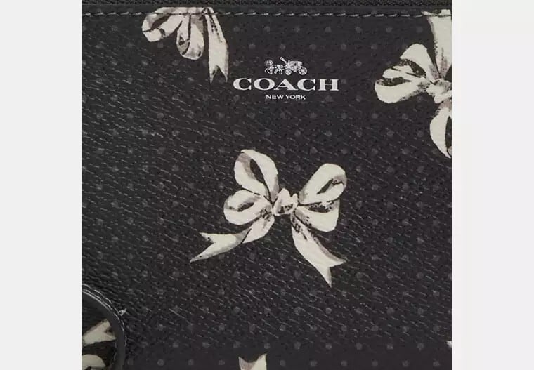 COACH（コーチ）/コーナー ジップ リストレット/CZ441 /ボウ プリント