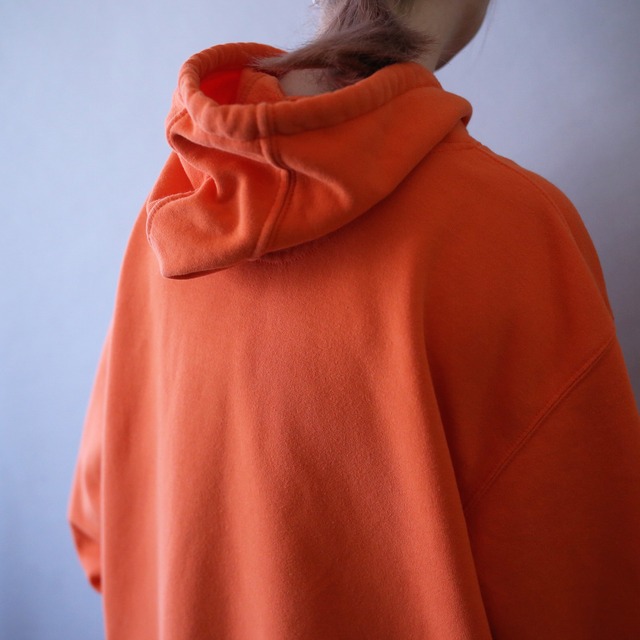 "Carhartt" sleeve logo printed over silhouette orange sweat parka