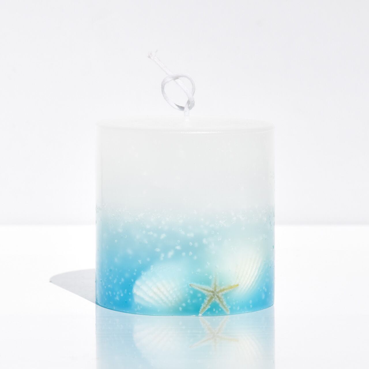 幻想的な気泡の混ざるシェルキャンドル｜ブルーグラデーション | SWEET