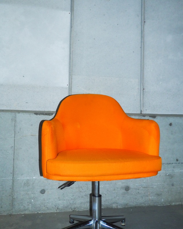 Orange swivel/height-adjustable shell-style personal chair