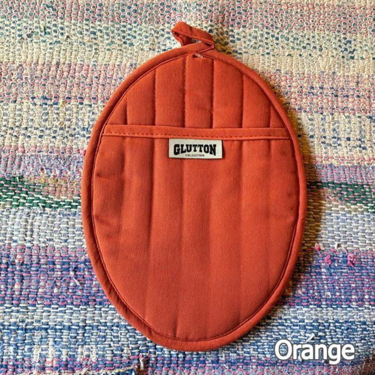 DULTON GLUTTON2 POT HOLDER 3 colors available: Orange, Yellow, and Green. Trivet and pot holder. Ships via mail.