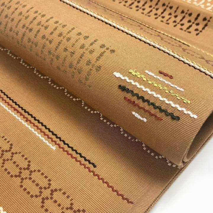 リバーシブル 洒落帯 袋帯 お太鼓柄 刺し子 組織 未使用に近い イ5989 袋帯 洒落帯 刺し子 紬 横柄織模様 幹色 O-2070 着物 きもの