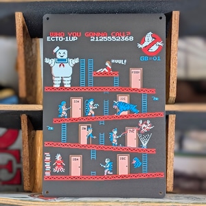 送料無料!ちょうどいいブリキ看板 【 GHOSTBUSTERS / ゴーストバスターズ 】 マシュマロマン / METAL SIGN / メタルサイン / ブリキ看板 / サインボード / ビンテージ加工〚アメリカン雑貨 アメトイ〛