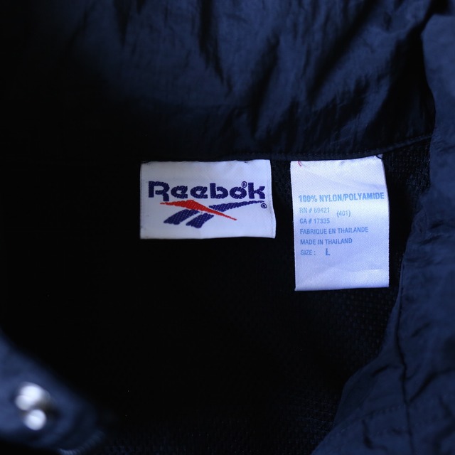"Reebok" sleeve embroidery logo design over silhouette monotone nylon anorak