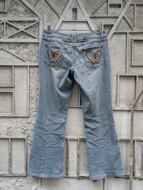 "NO BOUNDRIES" butterfly embroidery flare denim pants