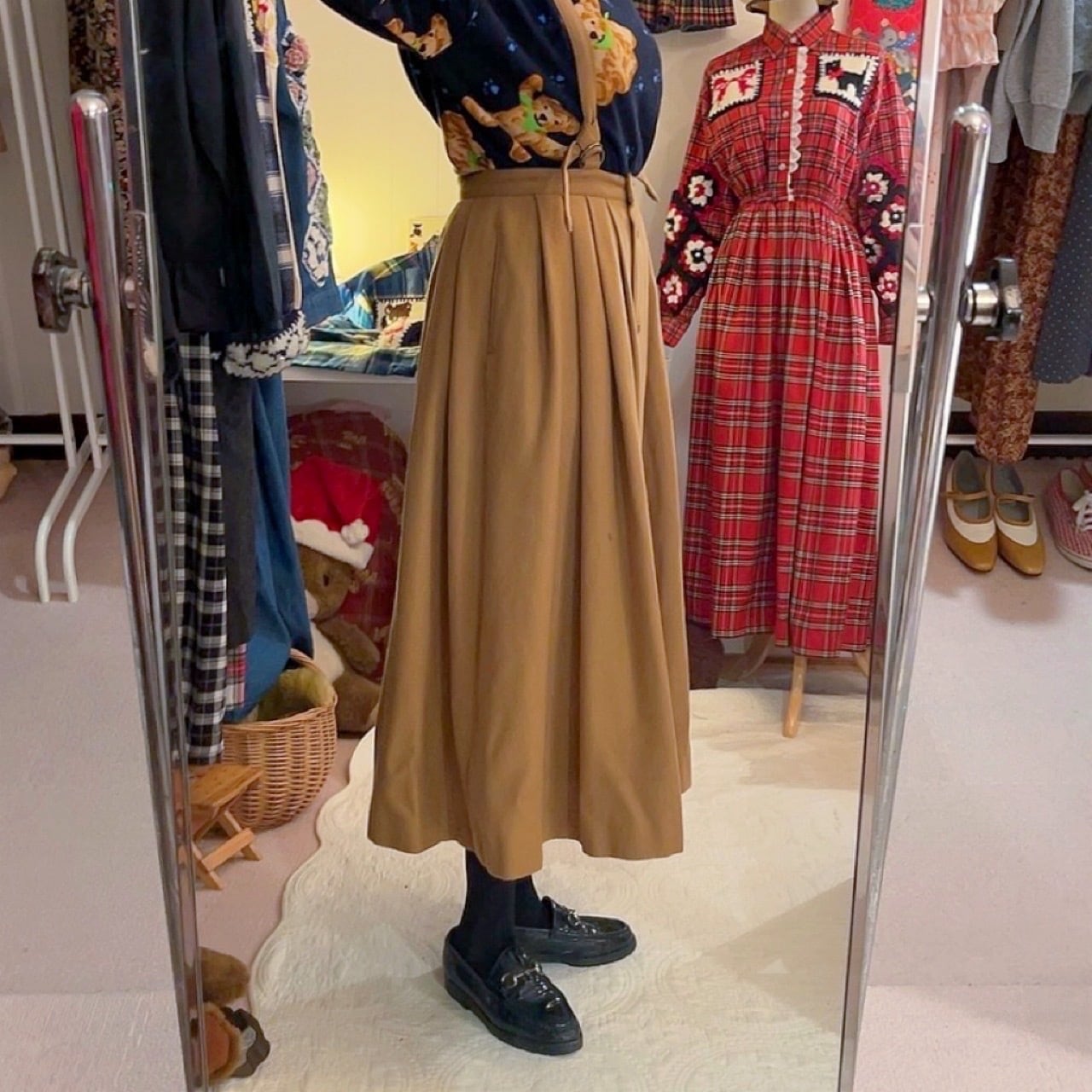 beige front button suspender skirt