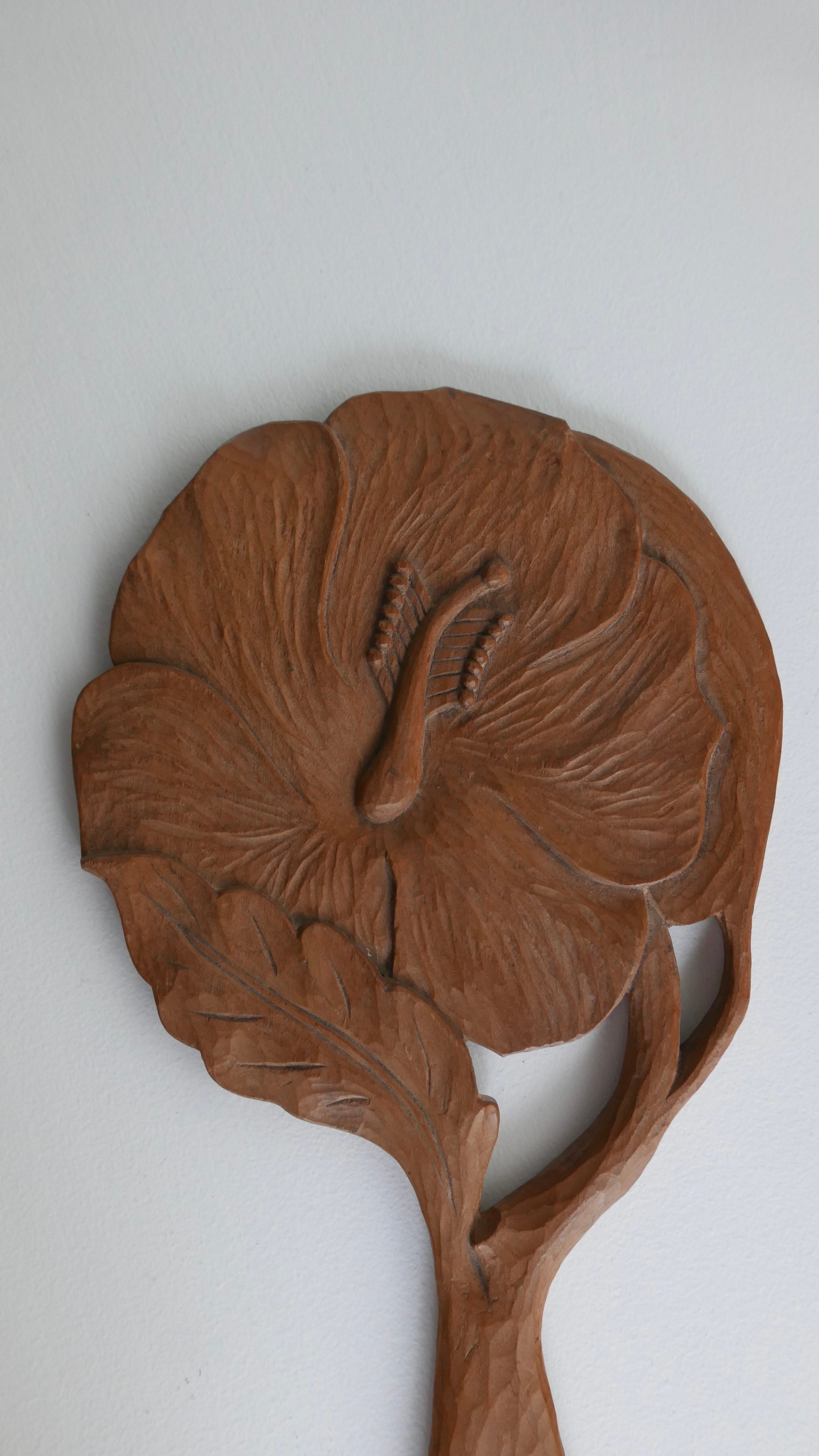 carved hand mirror , hibiscus