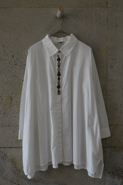 Button-filled, uniquely shaped shirt