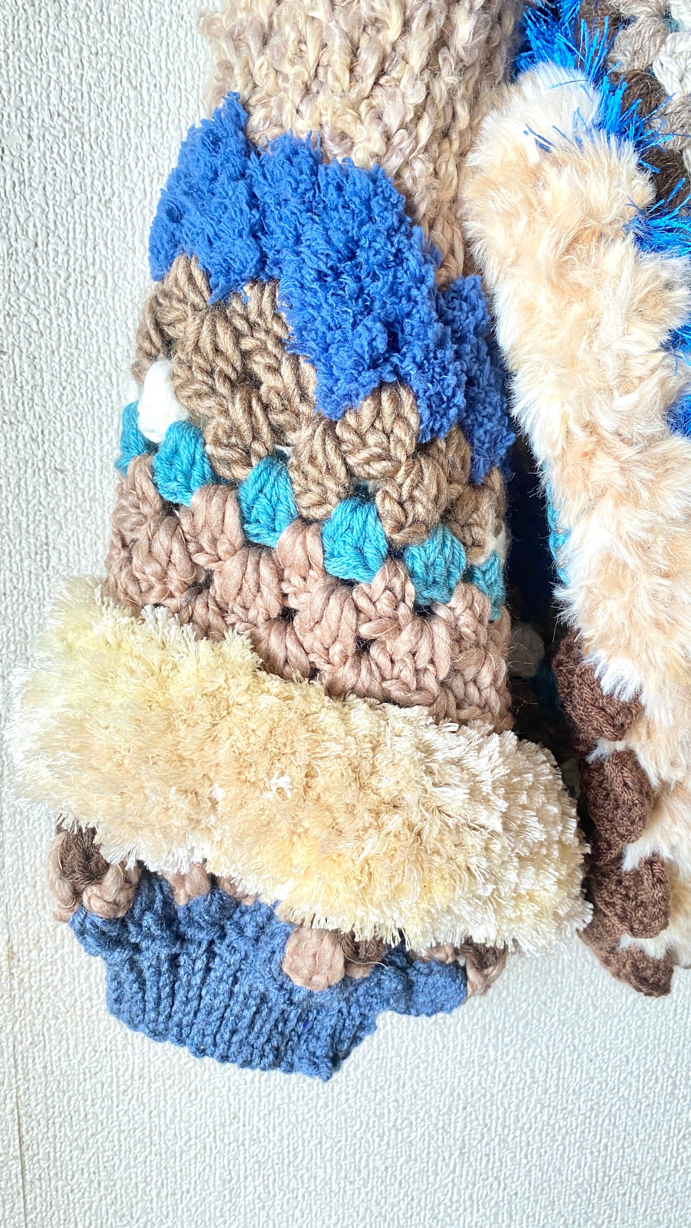 Crocheted granny hexagon and square motif asymmetrical cardigan