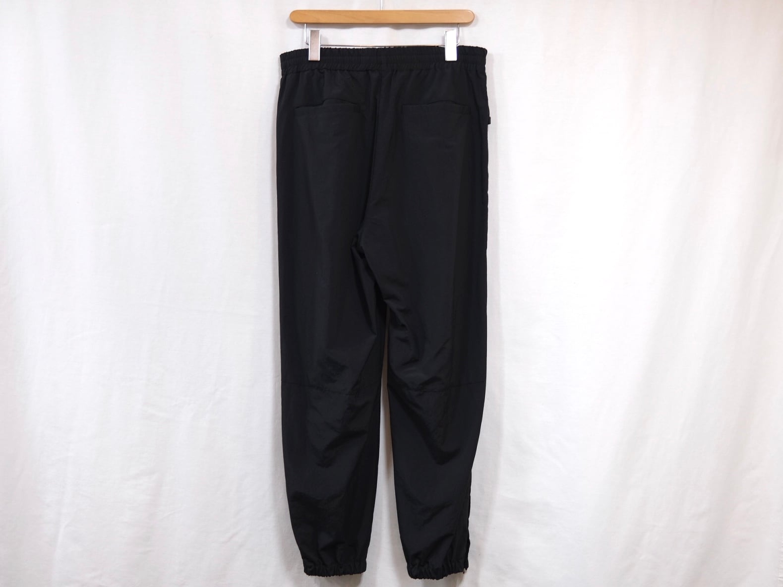 UNIVERSAL PRODUCTS.” NYLON SHELL TRACK PANTS BLACK” | Lapel online