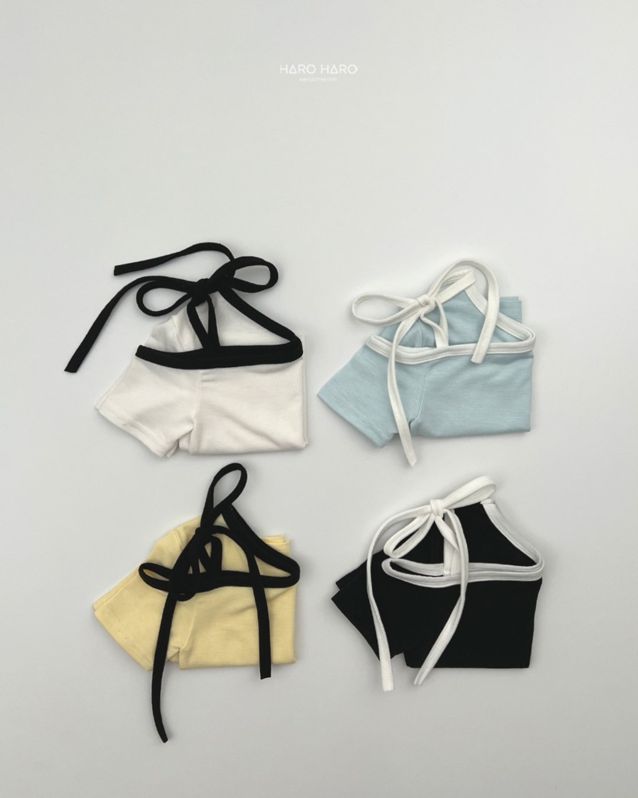 [HARO HARO] Ribbon Asymmetrical Shoulder Top / [하로하로] 리본언발숄더티