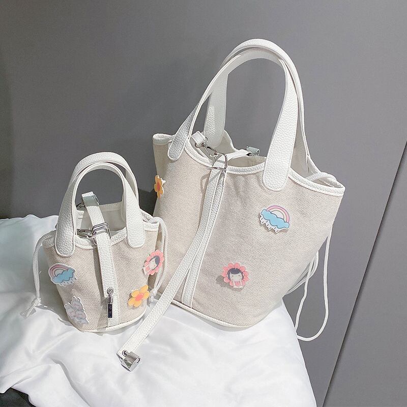 女性の小さなバッグ女性のバッグ2020夏の新しい波キャンバス野生のショルダーメッセンジャーバッグinsファッションバケットバッグ Tiancai_Wing_Bag8455614