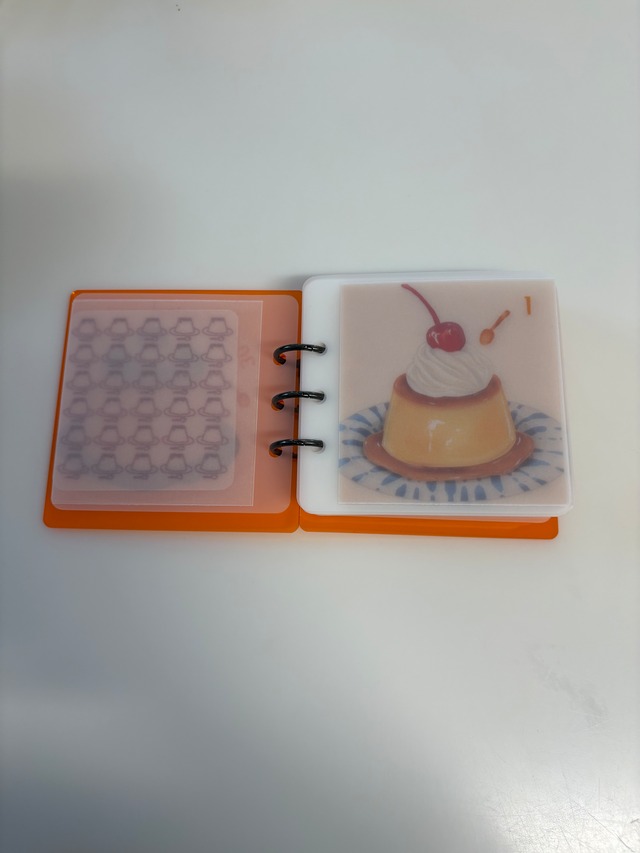 プリン30day貯金バインダーとオレンジアクリルバインダーのセットの画像