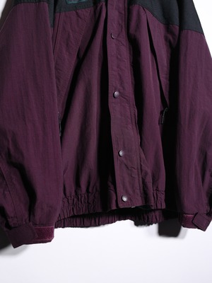 "Colombia" poison coloring over silhouette mountain jacket