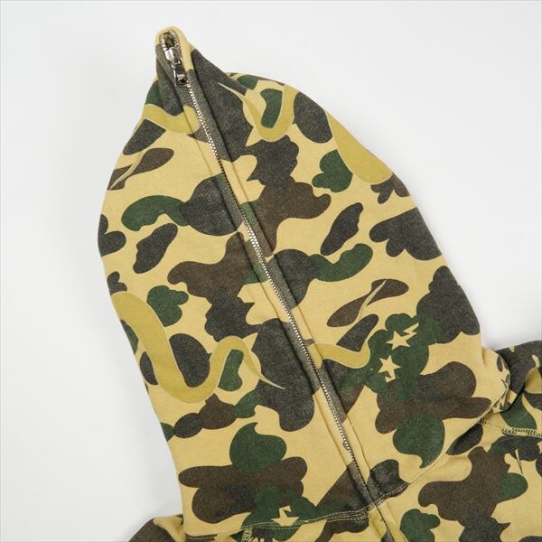 A BATHING APE×KAWS　パーカー黄カモ Size【M】 A BATHING APE ア ベイシング エイプ ×KAWS YELLOW CAMO