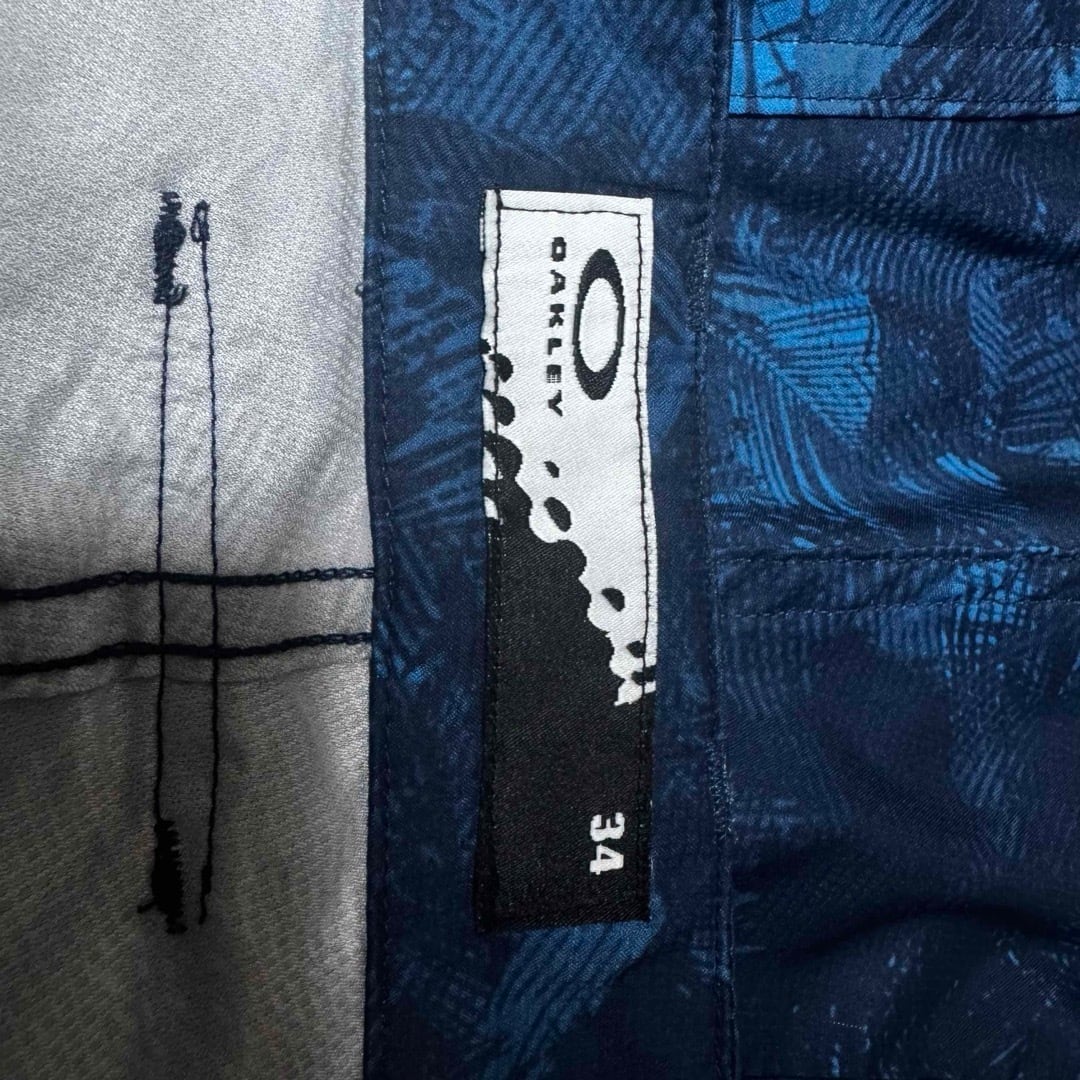 OAKLEY オークリー 刺繍 ロゴ 総柄 ハーフパンツ ブルー系 34 メンズ メンズ】OAKLEY オークリー 刺繍 ロゴ 総柄 ハーフパンツ ブルー系 34