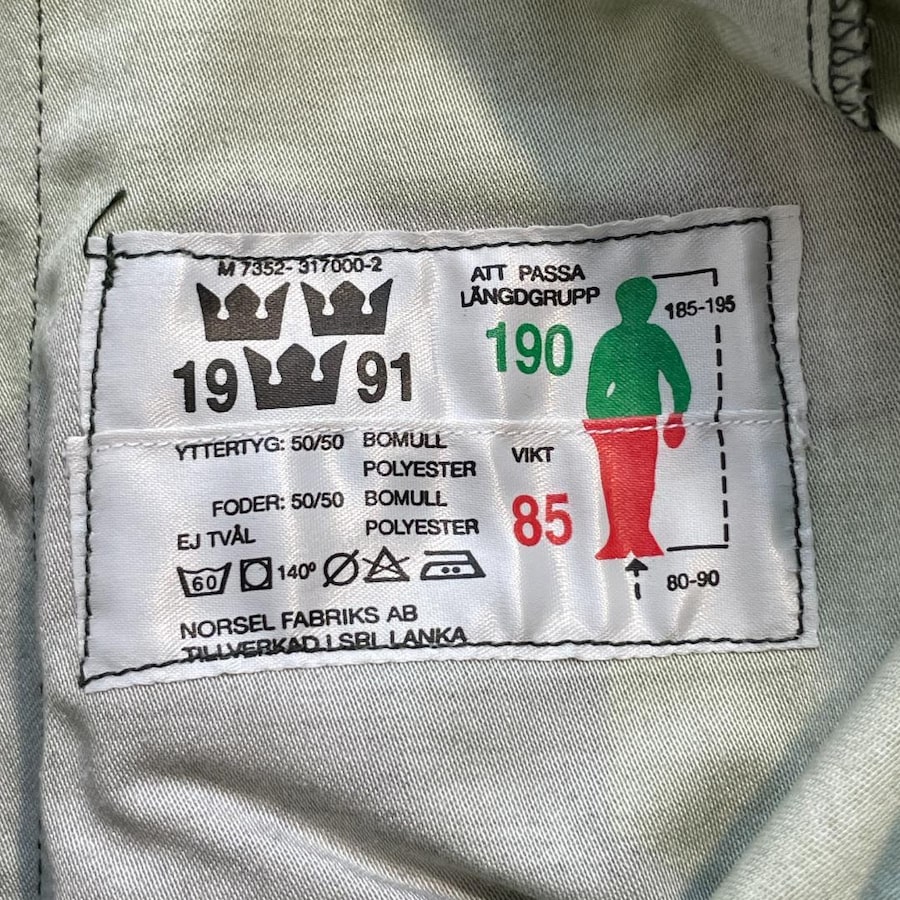 スウェーデン軍M90迷彩パンツのラベル 190と85の数字と人の形の図