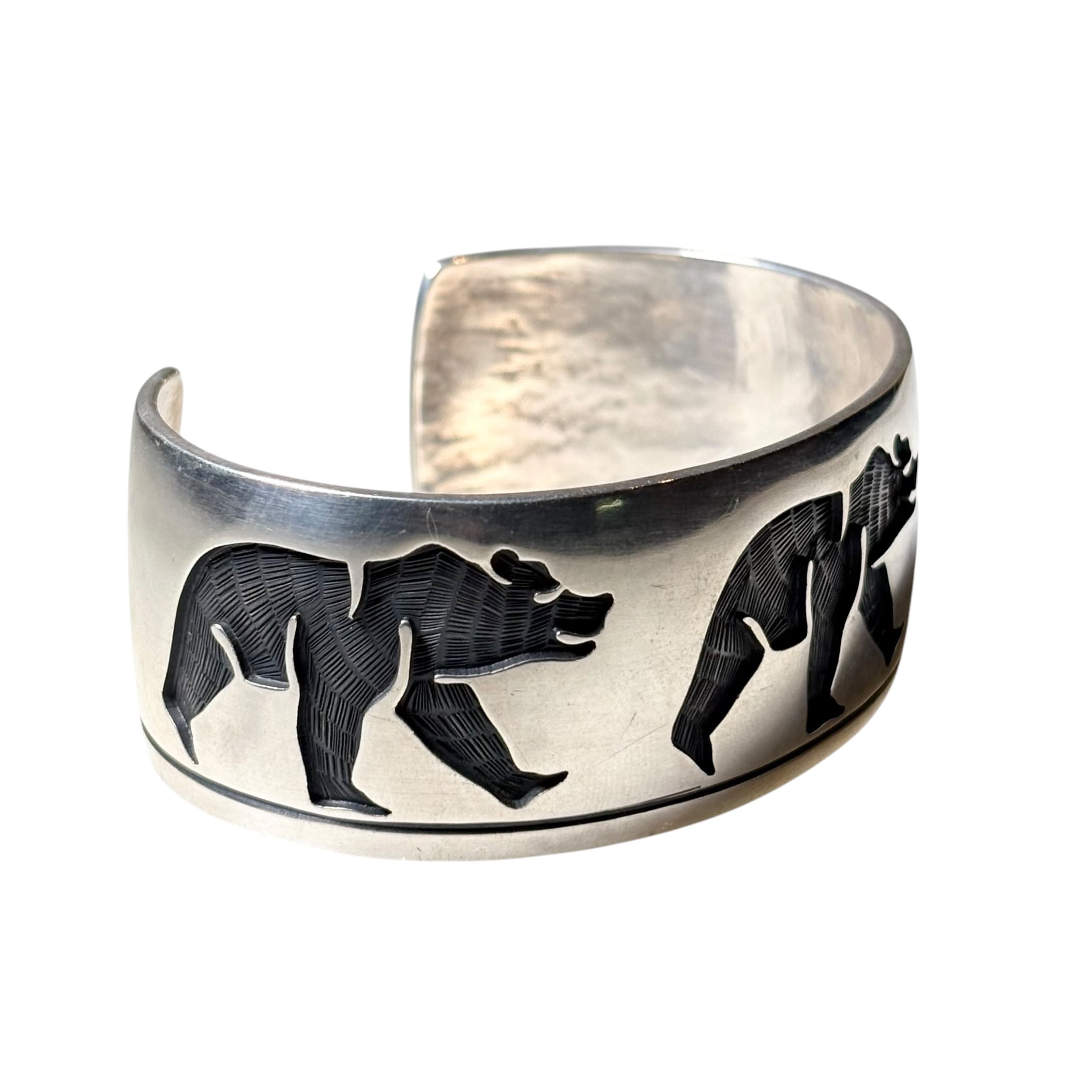 Hopi Lawrence Saufkie silver overlay bangle “walking bear” | NOIR