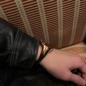 BURBERRY heavy gauge gold color metal oval cuff bangle