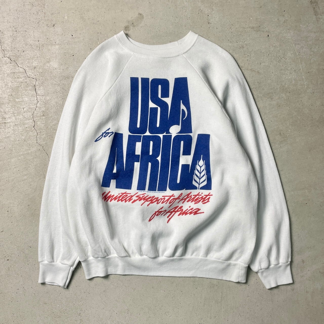 80年代 USA製 WE ARE THE WORLD USA for Africa スウェットシャツ メンズM-L相当 古着 80s  1985マイケルジャクソン シンディローパー ライオネルリッチー スティービーワンダー バンド アーティスト ヴィンテージ VINTAGE  ラグランスリーブ ホワイト