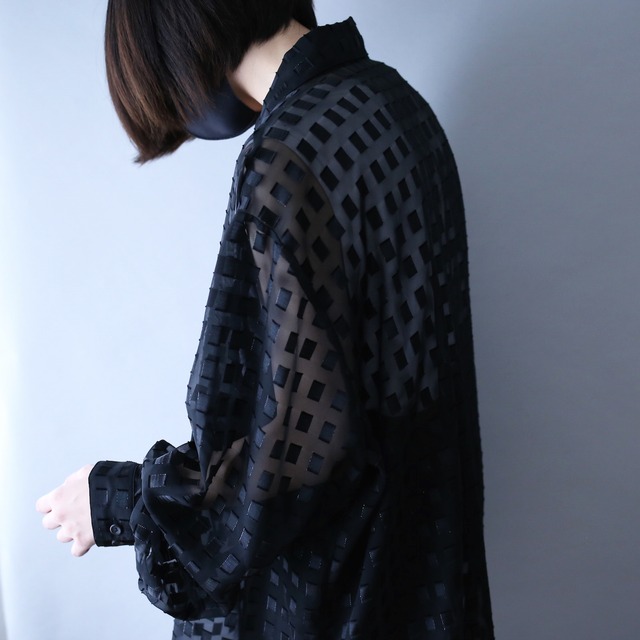 block pattern XXX over silhouette black see-through shirt