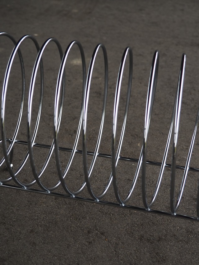 Stainless steel spiral magazine rack