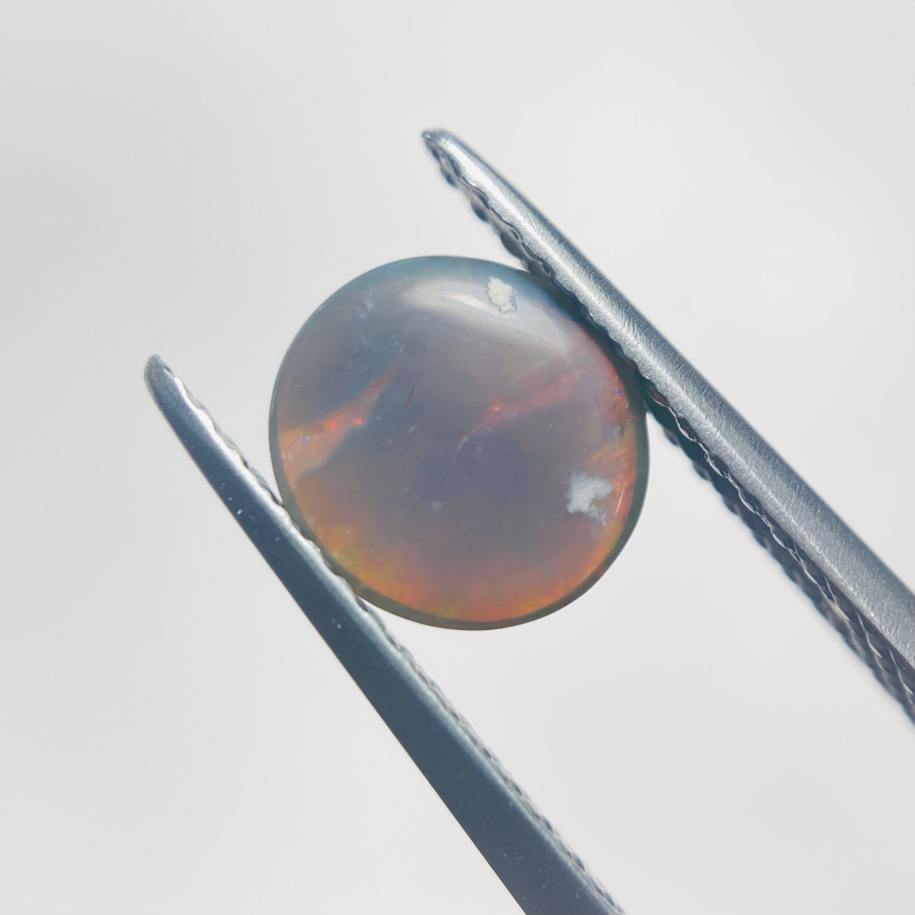 地球画家による渾身の作品　色の戯れブラックオパール