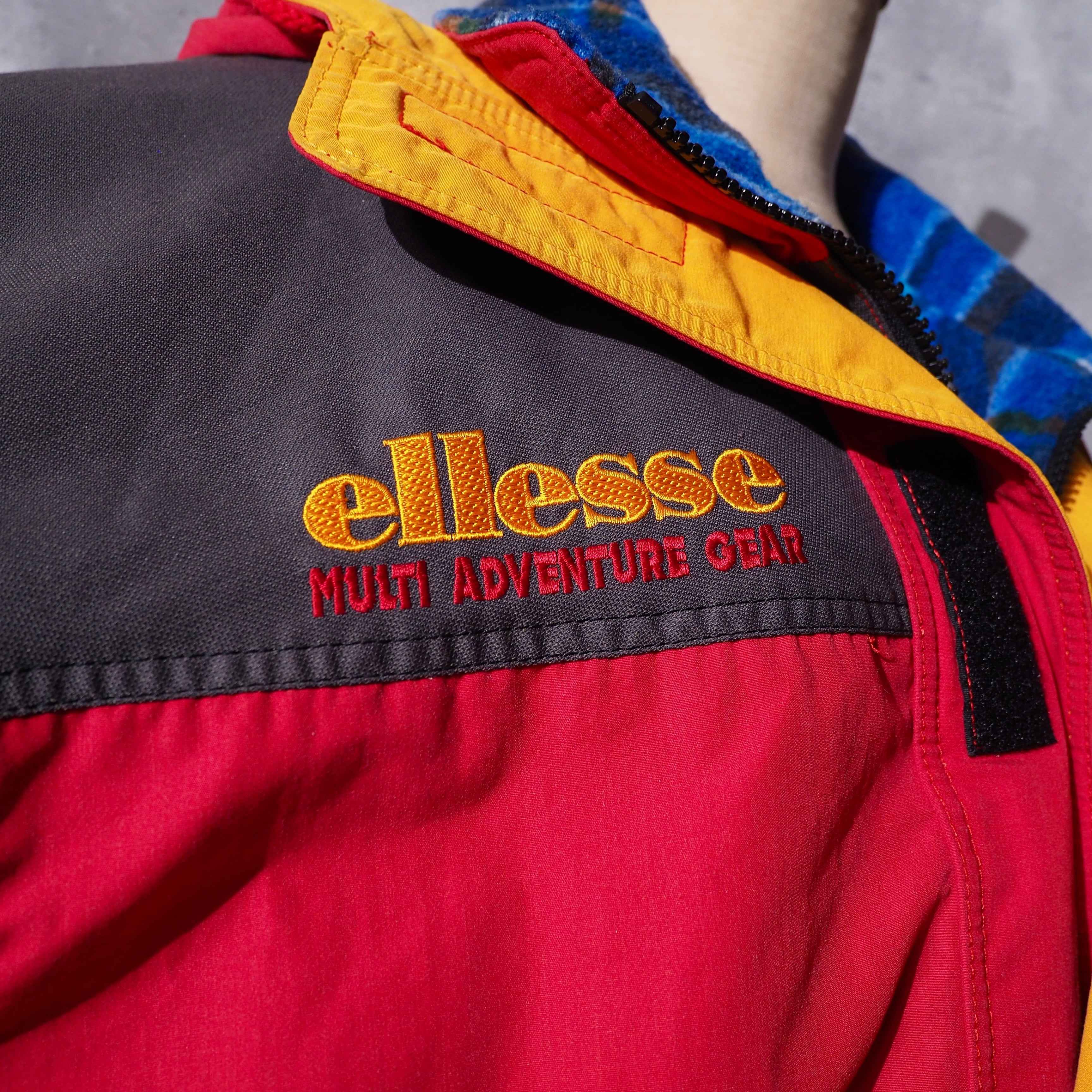 1980 - 90s ” ellesse ” Good multi color full zip vintage nylon jacket Parker