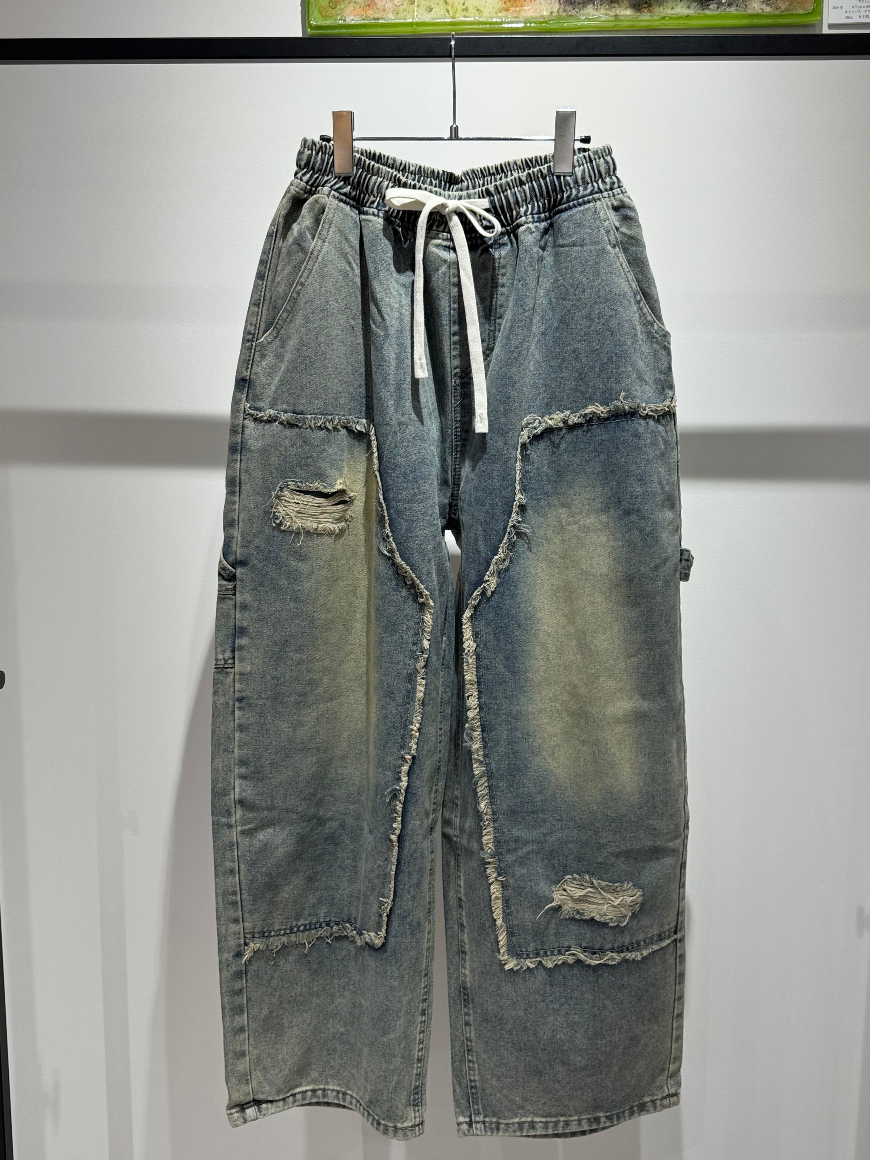 blocking damage curve denim pants