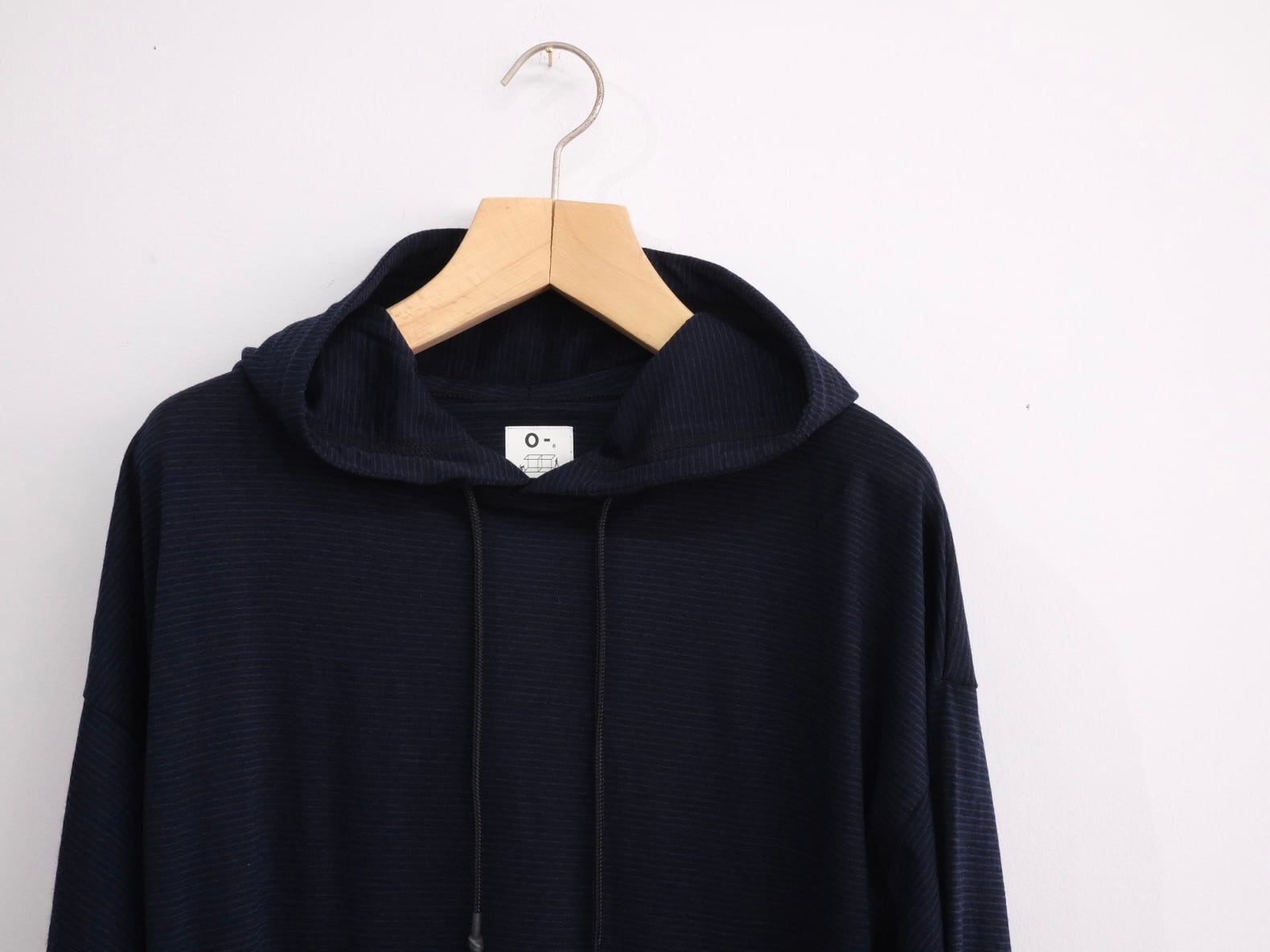 O-(オー/レイチョウルイラボ) “MERINO HOODIE Black Navy Night Stripe