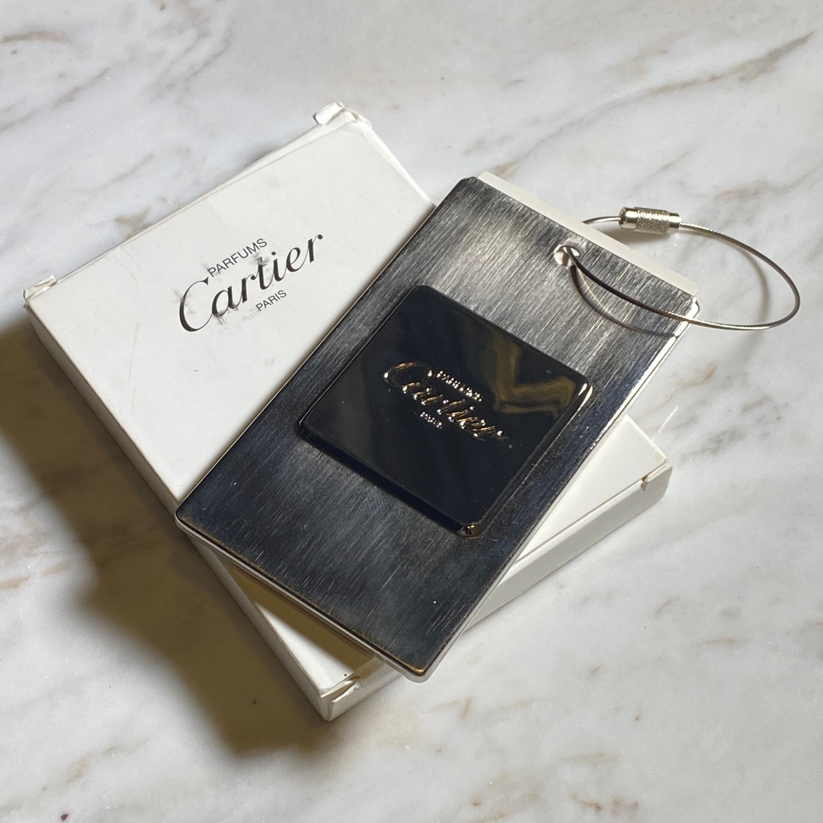 CARTIER luggage tag | NOIR ONLINE