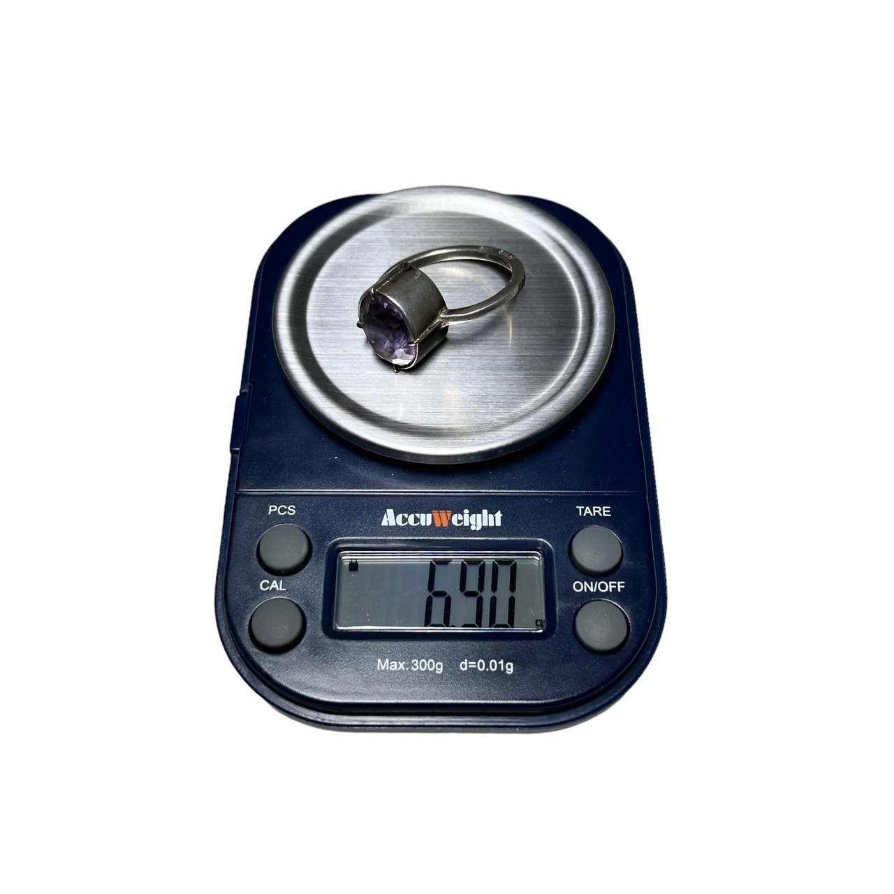 vintage silver ring set with purple rhinestone made in England