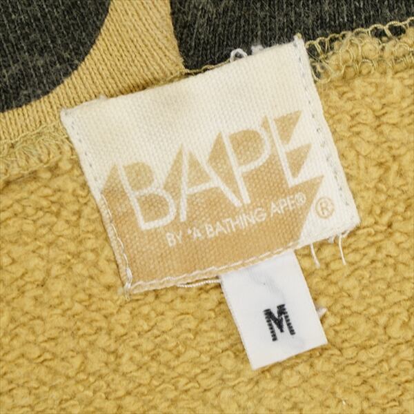A BATHING APE×KAWS　パーカー黄カモ Size【M】 A BATHING APE ア ベイシング エイプ ×KAWS YELLOW CAMO