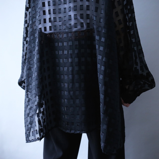 block pattern XXX over silhouette black see-through shirt