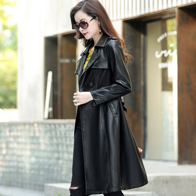 秋の革のコートの女性ロンググリーンサッシダブルブレスト拡張革風